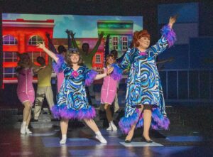 a group of people standing on top of a stage