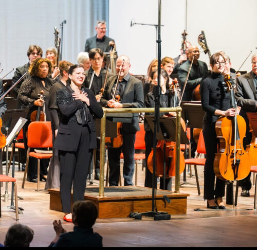 a group of people that are standing on a stage