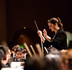 a conductor and conductor in a orchestra