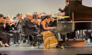 a group of people playing instruments on a stage