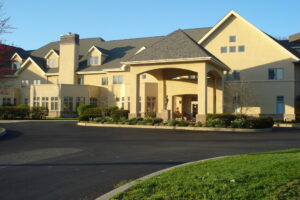 a large yellow building with a lot of windows
