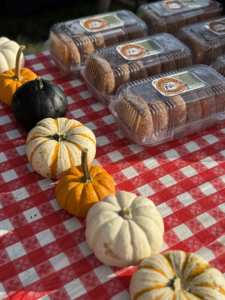 pumpkins and gourds are sitting on a table