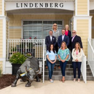 a group of people standing in front of a building
