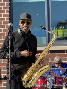 a man playing a saxophone on a stage