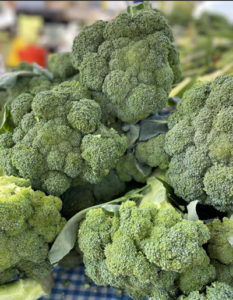 a pile of broccoli sitting on top of a table