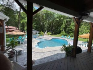 a view of a pool from inside a house