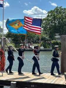 a group of people that are standing on a dock