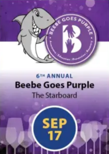 a purple and white flyer with a shark on it