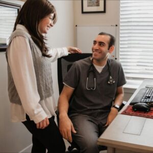 a man and a woman sitting at a desk
