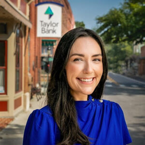a woman standing in front of a store