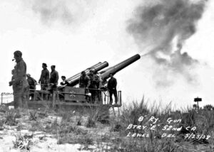 a group of men standing next to a cannon
