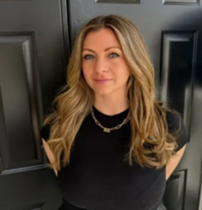 a woman standing in front of a door