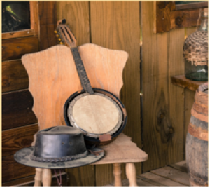 a wooden chair with a hat on top of it