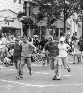 a crowd of people walking down a street