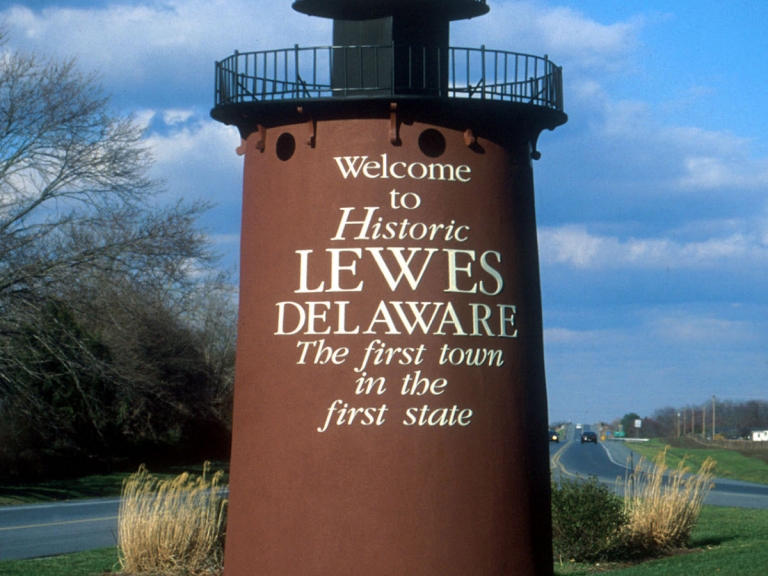 a large brown tower with a sign on it